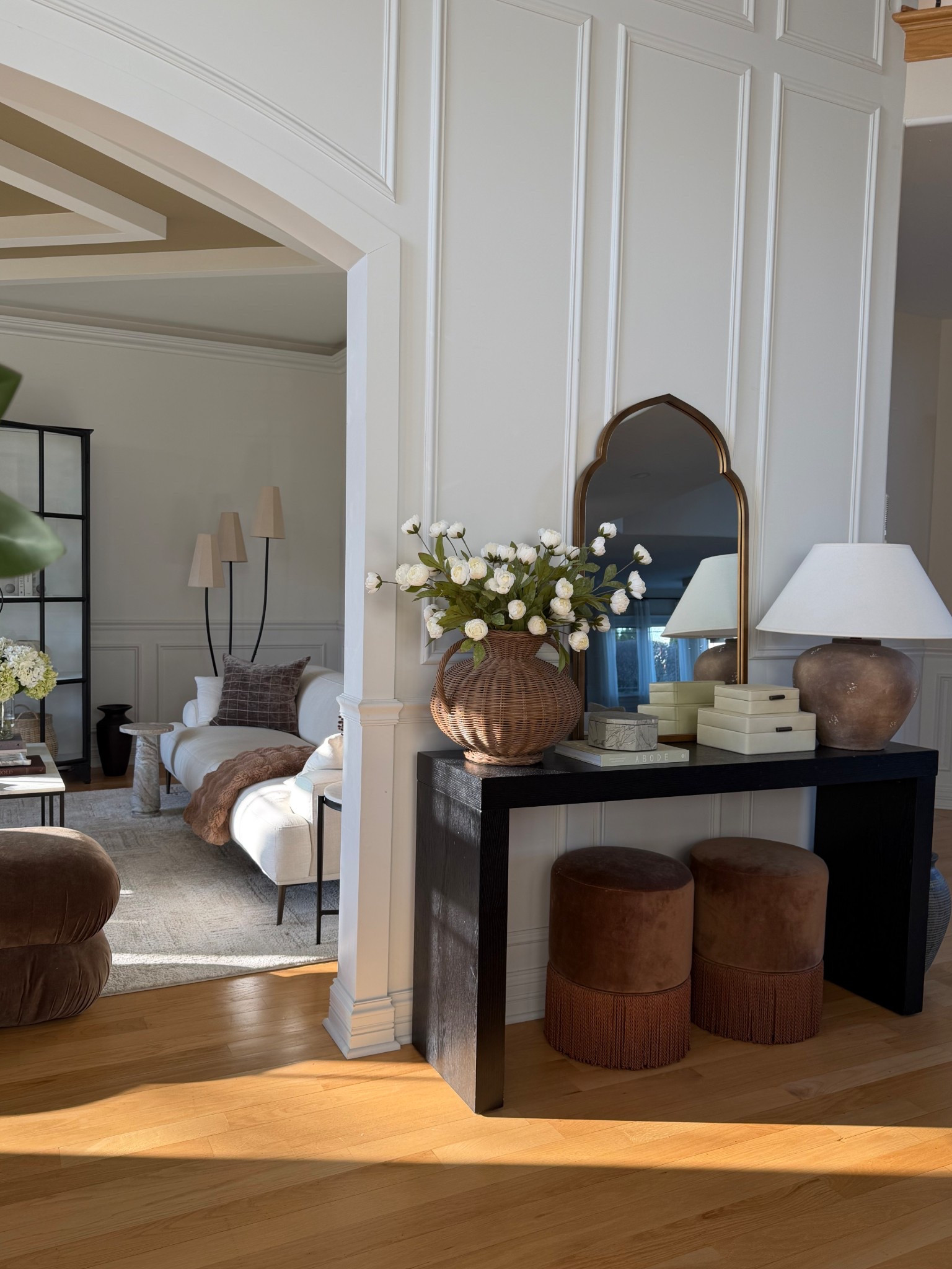 A little entryway moment 🤍

I love keeping this space simple with a few warm textures — a woven vase with stems, stacked decorative boxes, and a soft table lamp to add warmth in the evenings. Sharing the console table, mirror and a few of the styling pieces here. 

#LTKSeasonal #LTKHome