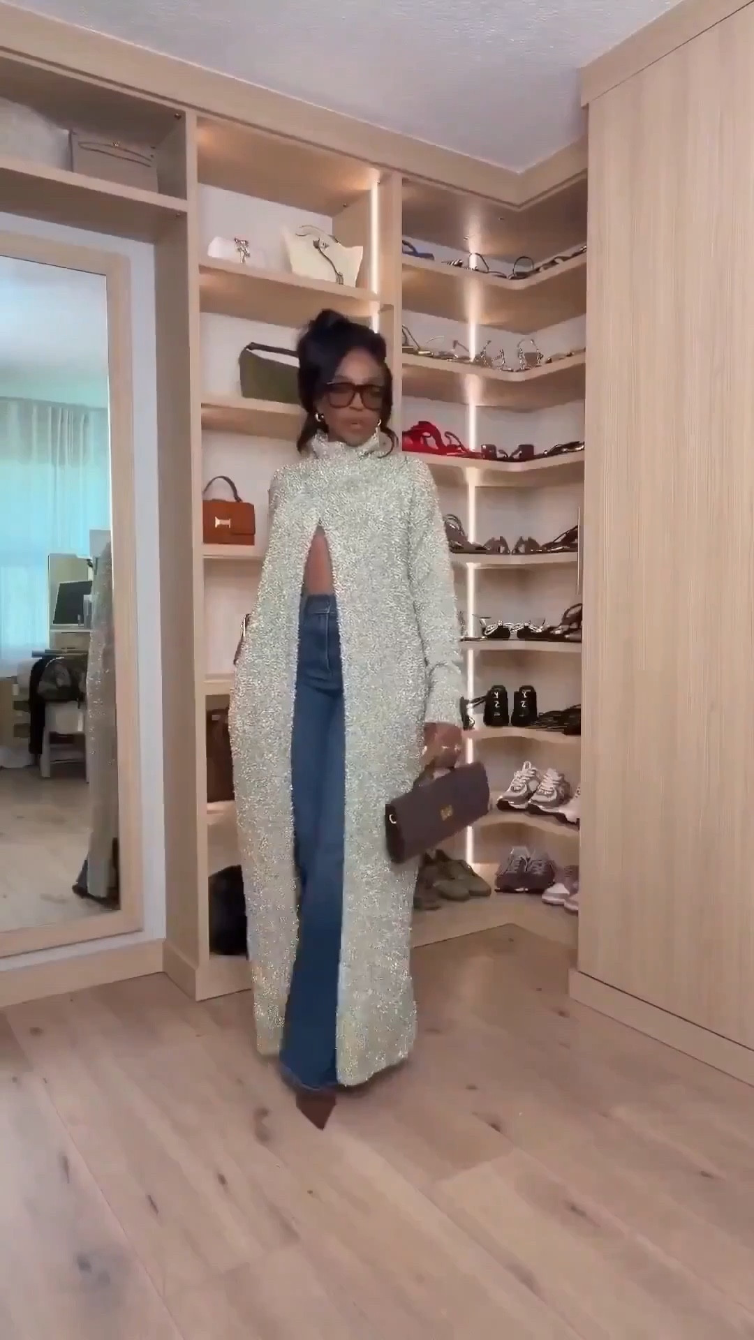 The statement coat that steals the whole outfit ✨  

This textured longline coat instantly elevates simple denim and heels into a full moment. The dramatic length elongates the frame, the high neckline keeps it polished, and the subtle sparkle makes it feel luxe without trying too hard. Throw it over basics and suddenly the cost per wear makes sense — because it transforms everything underneath.

Minimal base. Major impact.

Perfect for:
• Fashion week looks  
• Dinner dates  
• Fall & winter events  
• Travel outfits  
• Elevated everyday styling  

📏 Sizing:  
Coat: Size Small  
Jeans: 27 Long  
Heels: True to size  

📐 Measurements:  
5’4” · 138 lbs · 34D bust · 27” waist · 40” hips  

Tap to get details and save this if you love a bold layering piece.

Statement coat women, long textured coat outfit, elevated denim look, chic layering piece, fashion forward outerwear, dark wash denim styling, luxe minimalist outfit.

Follow me on Instagram and YouTube @kirasfashionfinds 