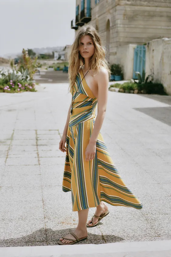 Asymmetric neckline dress with adjustable spaghetti strap. Fitted waist with pleats. Asymmetric h... | Zara US