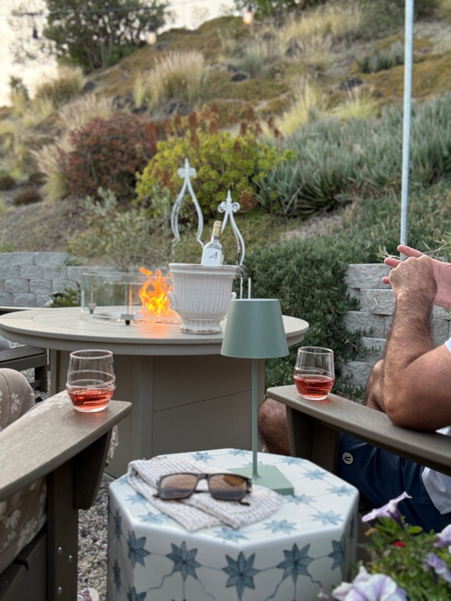 Relaxing by the fire pit
Using a planter as a wine bucket
Outdoor spring decor

#LTKdayinmylife #LTKSeasonal #LTKmomlife