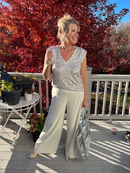 Holiday outfit

Sequins v neck top
TTS and not itchy 

Cream trousers with satin band 
Runs big 

Save 10% with code DARCY10

Boots cream with silver caps tts

Oversized  Metallic silver bag 

#LTKHoliday #LTKworkwear #LTKstyletip
