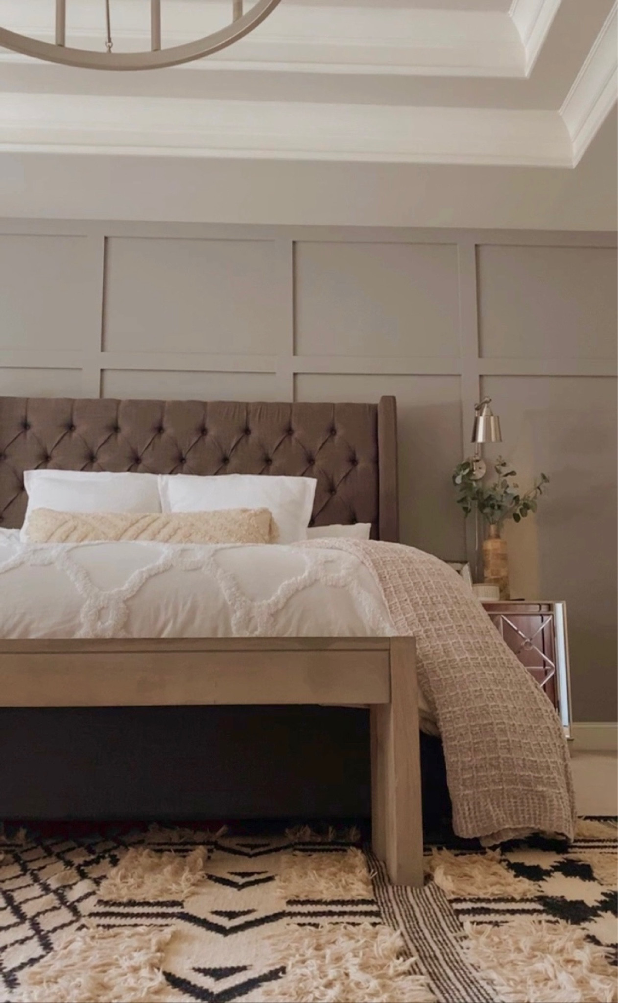 Master bedrooms are all about the details!  Tribal rug, wood bench, swing arm lamps, tufted bed, home decor.

#LTKhome #LTKstyletip