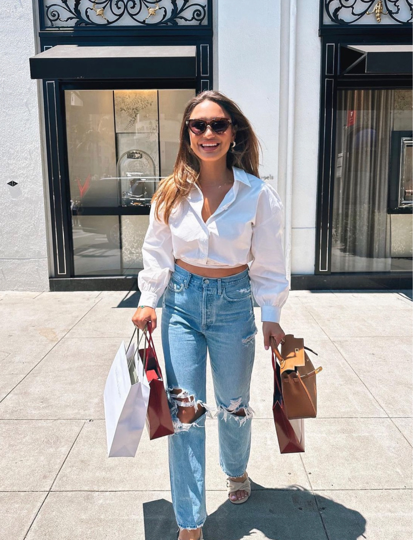 Long sleeve cropped shirt, blue ripped jeans, beige sandals, black sunglasses, brown handbag

#LTKSeasonal #LTKeurope #LTKstyletip