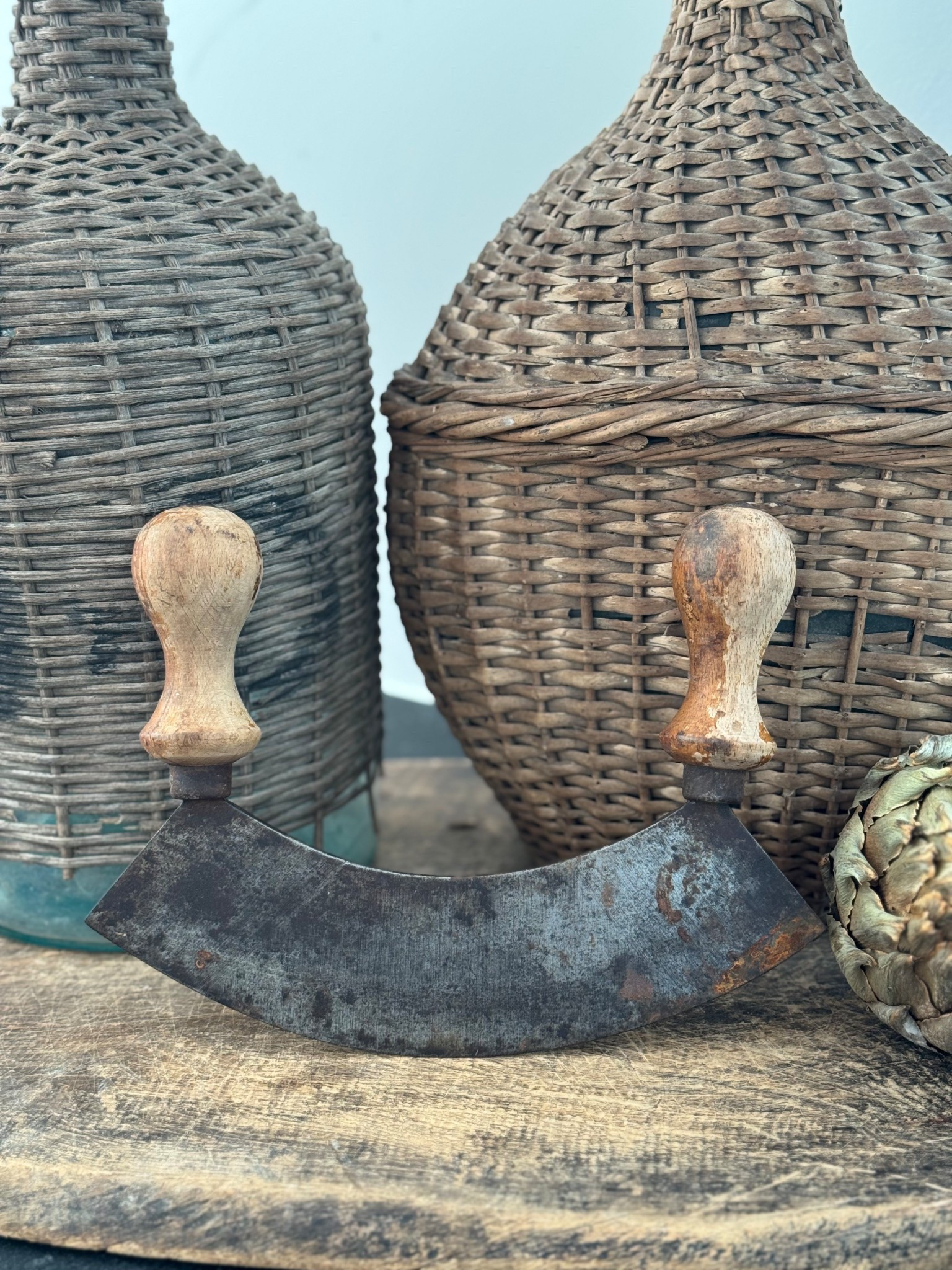 Where function meets quiet beauty.
An antique double-handled mezzaluna with timeworn wood and aged steel—once a hardworking kitchen tool, now a sculptural accent layered among stoneware and patina-rich textures. Pieces like this remind me that the most beautiful objects are the ones that have lived a life.

Curated & collected by Our Nido. 🤍