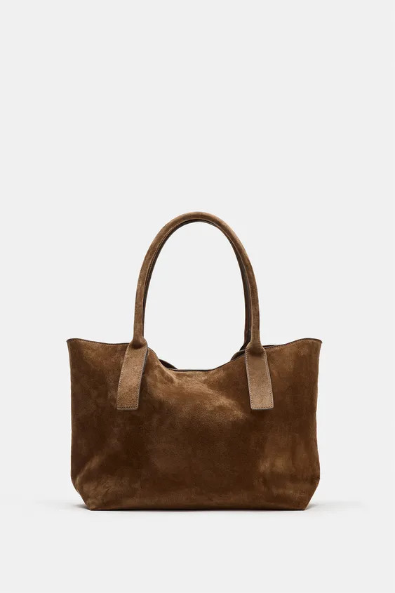 Leather shopper bag. Double shoulder handles. Interior zippered pocket. Magnetic button closure.H... | Zara US