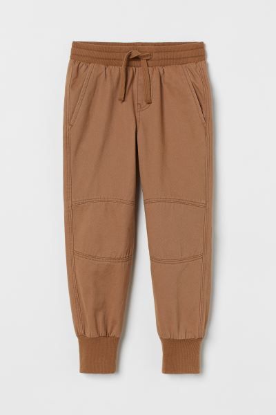 Joggers in washed, lightweight cotton twill. Ribbed, drawstring waistband, diagonal side pockets, an | H&M (US + CA)