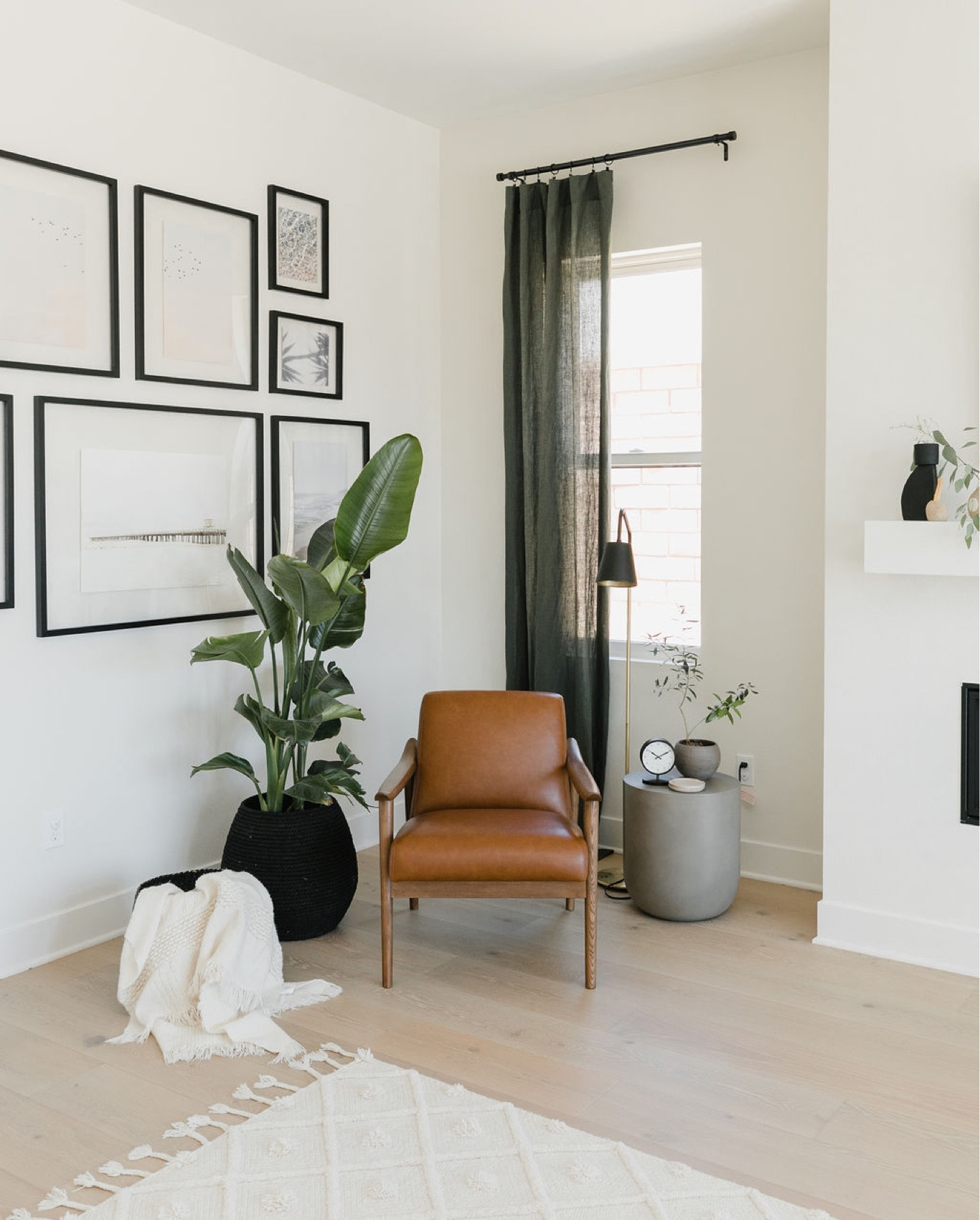 Modern coastal living room with a beachy gallery wall with floating frames, sheer curtains and plants. 

#LTKunder100 #LTKstyletip #LTKhome