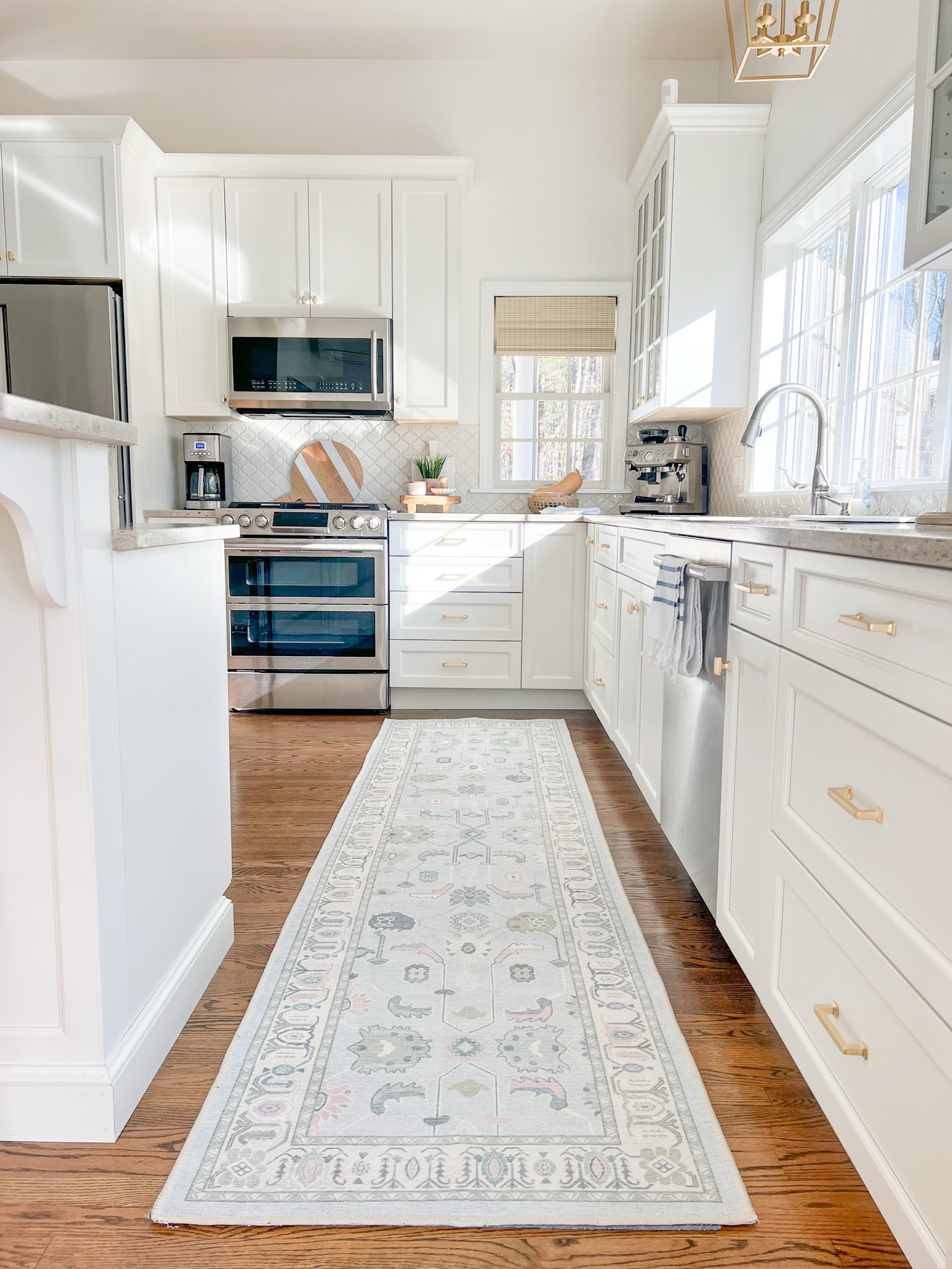 This kitchen runner is available in most standard rug sizes, is well priced, AND it's washable!! My woven shades are the Capri Ivory color. 
----
Amazon Kitchen runner, woven blinds, woven shades, kitchen decor, home decor, coastal kitchen, coastal styling, coastal home deco, Amazon runner rug, Amazon kitchen rug, Amazon coastal rug, affordable rug, washable rug, coffee maker, cuisinart coffee maker, glass soap dispensers, Amazon reusable soap dispensers, home, kitchen, neutral home, neutral kitchen, storage bag organizer, wooden organizer, bamboo expandable drawer organizer, antique brass cabinet pulls, beach house style, beach home, coastal style, Amazon rugs, Amazon rugs, blue and white runners, coastal Amazon decor

#LTKHome #LTKSaleAlert #LTKFindsUnder100