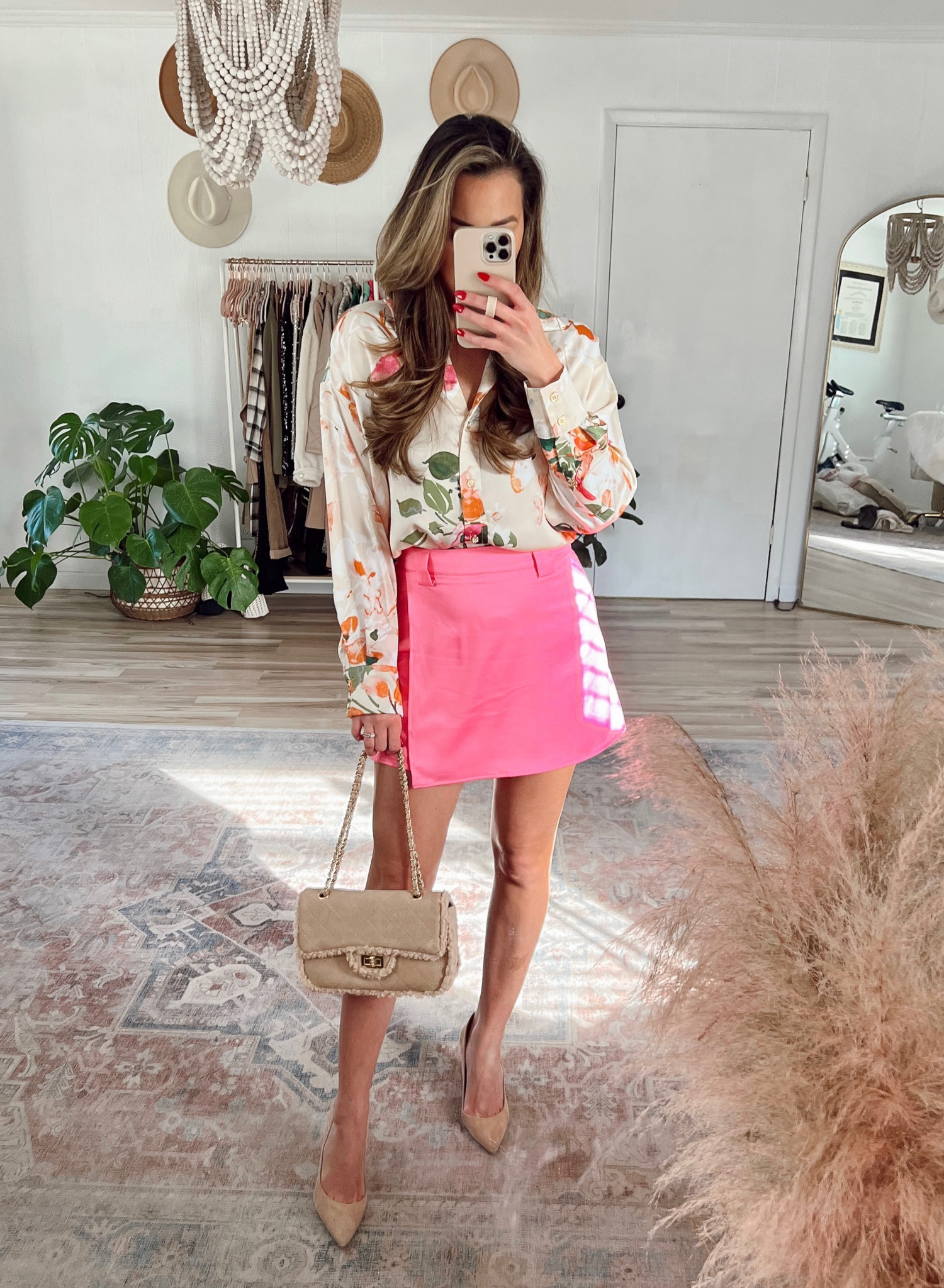 Spring floral blouse with hot pink skirt outfit. Nude bag and heels. Use code Ashley30 for a discount! 

#LTKstyletip #LTKunder50 #LTKSeasonal