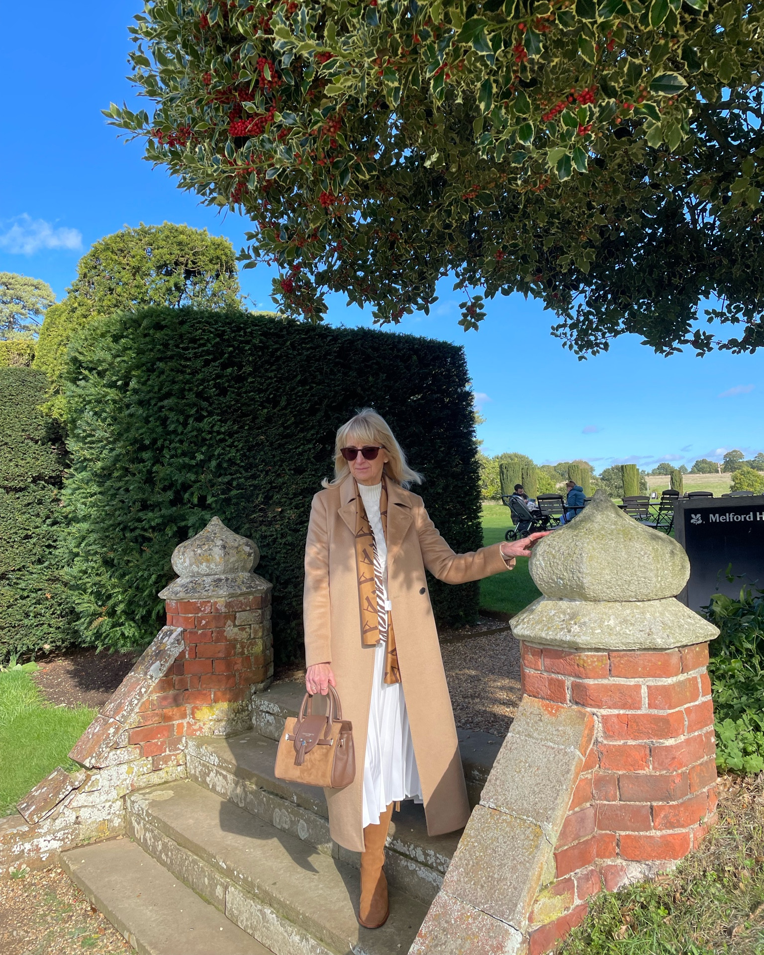 Wool Coat 
Hobbs camel coat midi length with neutral accessories and cream  cable knit jumper 

#LTKmidsize #LTKeurope #LTKSeasonal