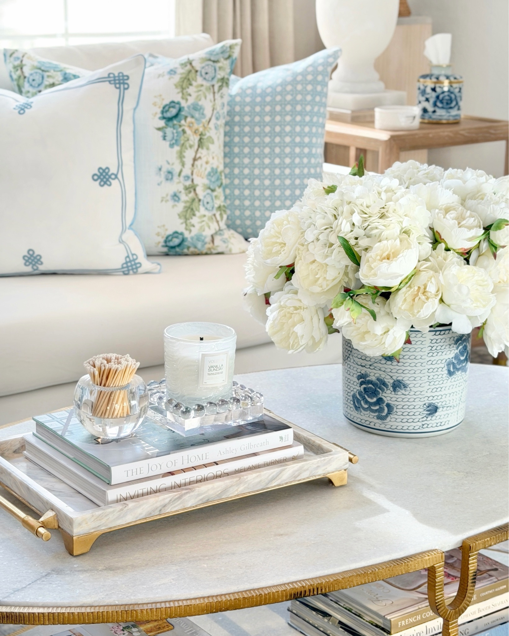 A little coffee table refresh while I wait for my new summer accessories to arrive! ☀️This lucite bubble tray and match holder might just be my favorite duo right now! 💖 Also couldn’t resist grabbing a second match holder—especially with the pink matches 🩷 They come in so many pretty color options too!

And good news—my scalloped slipper chairs are back in stock in multiple colors and still under $200! 🤍

#springdecor #livingroomstyle #traditionalhome #chinoiseriechic #eleganthomes living room decor coffee table styling Amazon target tjmaxx interior Lillian chinoiserie  blue and white decor ginger jar elegant homes traditional decor home office styling Walmart chic decor white and gold feminine style interior design home decor summer decor Etsy coastal decor grand millennial