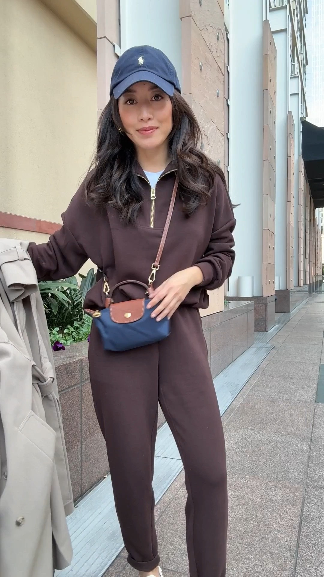 Code HELLOVARLEY for 10% off • Varley slim pant xxs 25" inseam, love these as well as the joggers linked. Super soft. I wash these in cold inside out, air dry 
• Varley sweatshirt xxs 
• Oak + Fort trench coat xxs (use code JEANTRENCH for 15% off) - Very loose fit and long, hits past midi length on me (5ft) but I wear this all the time. The material has a good weight and drapes well, and the style is effortless.

• Aritzia HomeStretch ribbed long sleeve tee I size up to XS great staple 

• Longchamp mini bag, with Amazon detachable strap kit 

• Polo hat

• old Zara sneakers

• Naghedi medium tote in cashmere

• Away the bigger flex carry-on suitcase, lightweight, roomy size and durable. I travel a lot with this.

Comfy travel outfit, mom ootd, lounge sweats matching set, petite friendly

#LTKPetite #LTKTravel #LTKootd