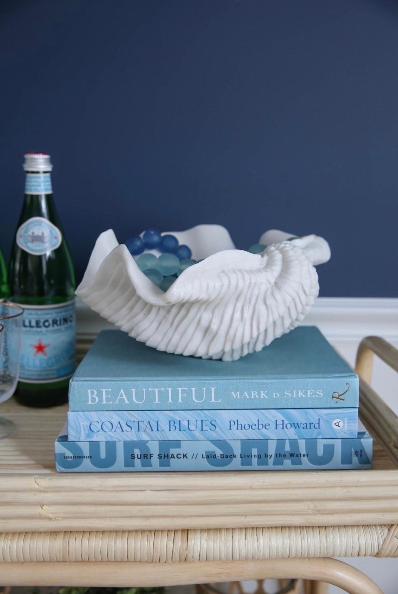 This stacked coastal coffee table book setup with a shell bowl and recycled glass beads brings effortless beachy style and texture to any space. I love how the layered books, natural elements, and coastal accents create a curated, designer-inspired look.

#LTKHome #LTKSaleAlert #LTKstorytime
