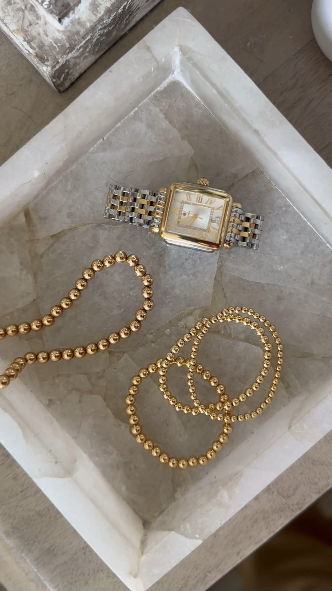 Beaded gold bracelets and watch. 
What’s on my nightstand. 

Scroll to shop.

#LTKOver40 #LTKBeauty