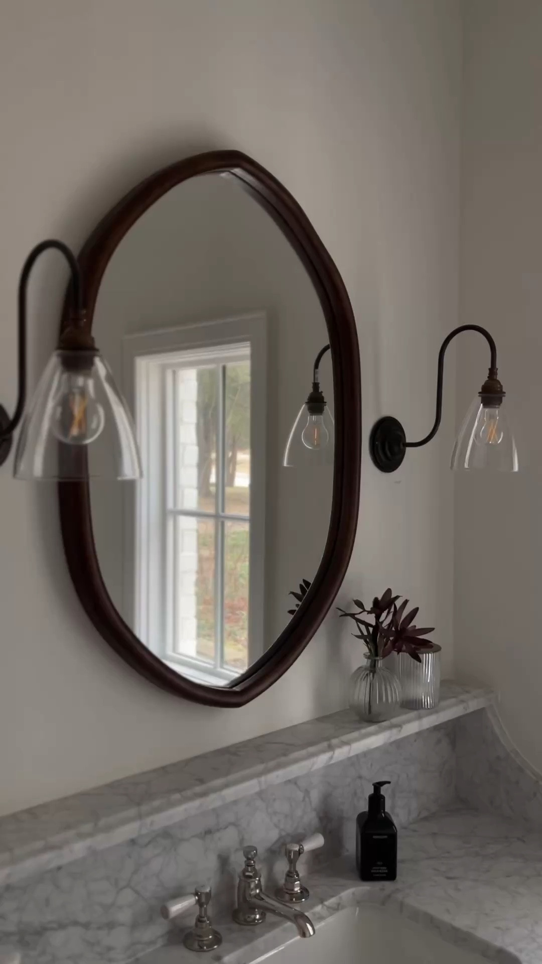 I loved adding darker, warmer tones in the guest bath to contrast the light space. These sconces with the walnut mirror are such a favorite for me. 

Sconces
Walnut
Mirror
Bathroom
Bathroom design
Bathroom decor
Lighting
Guest room
Interior design 

#LTKHome