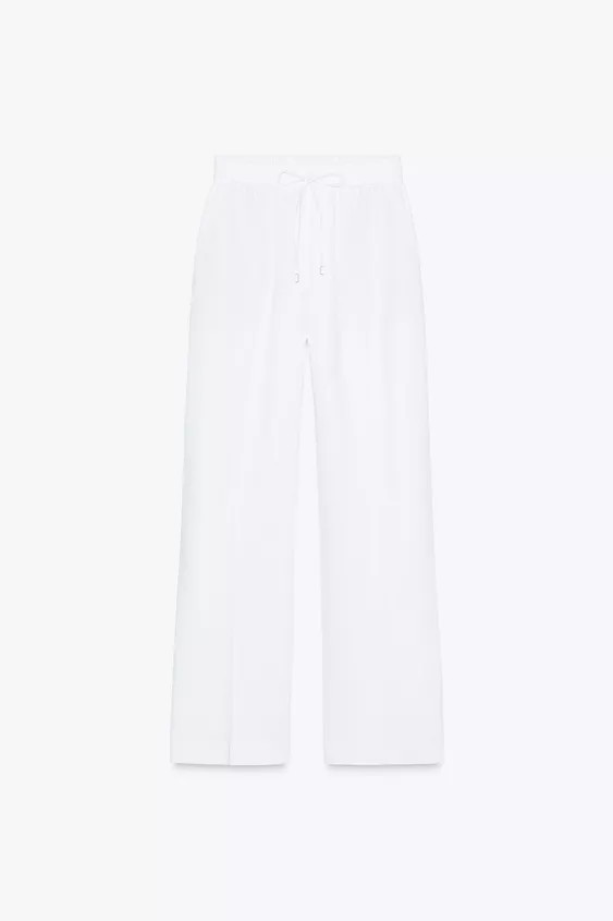 Linen blend pants. High waist with adjustable elastic drawstring waistband. Front pockets. Straig... | Zara US