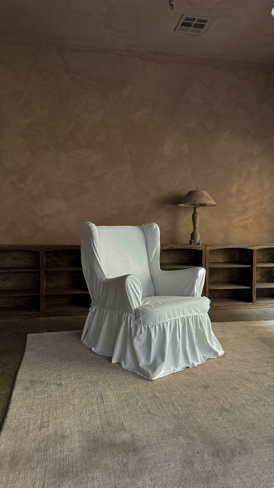 White Slipcover Chair for a Moody Living Room. 🤎

A white slipcover chair is one of my favorite ways to add contrast to a dark, moody living room. The relaxed linen look softens rich brown walls, dark furniture, and warm neutral tones while keeping the space feeling cozy, collected, and inviting instead of heavy.

#LTKHome