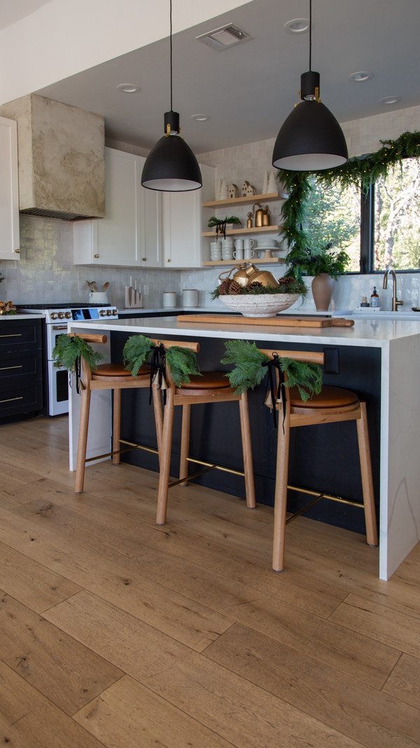 The sweetest touch of greenery in our kitchen — these Grandin Road barstool swags…