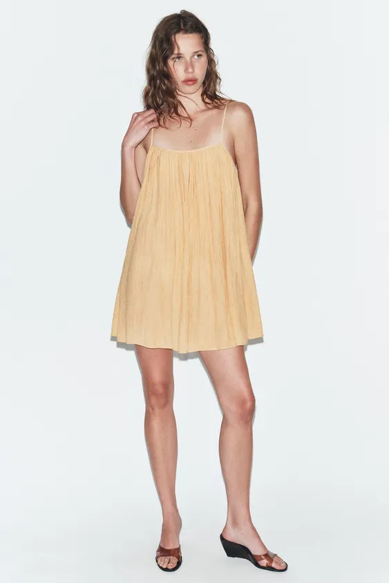 Dress with a round neckline and adjustable thin straps. Features invisible back zip fastening and... | Zara UK