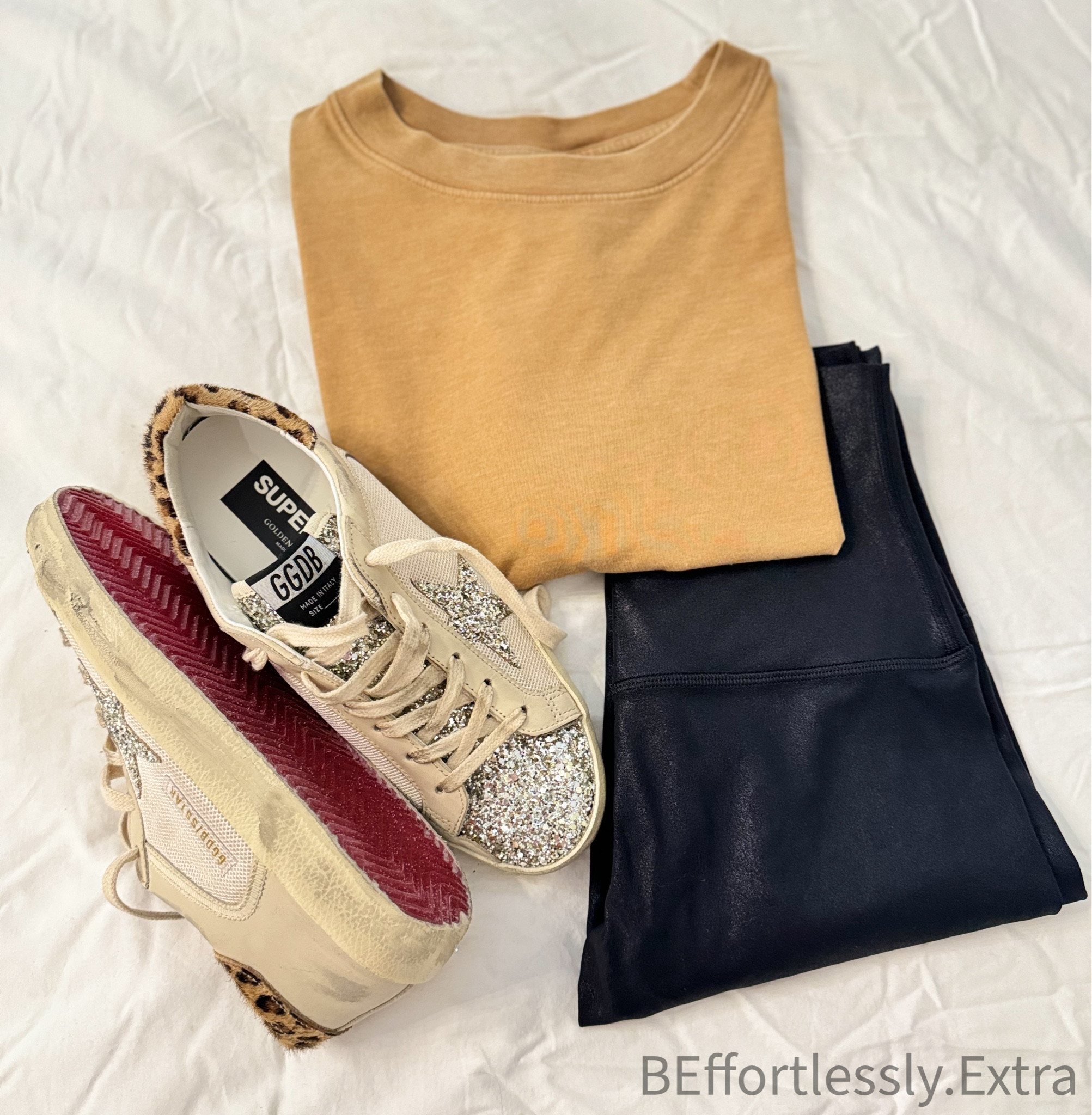 FALL OUTFIT INSPO

I love a longer crop & this tee doesn’t disappoint // comes in multiple colors and only $10. My leggings are my ALL TIME FAVS & come in this shimmery faux leather look- perfect for fall 🍂 Last but certainly not least- you already know I love all things glitter ✨ & leopard 🐆 - these Golden Goose are everything- I LOVE the glittery red bottoms! It’s the details for me ❤️

#LTKSeasonal #LTKshoecrush #LTKfindsunder50