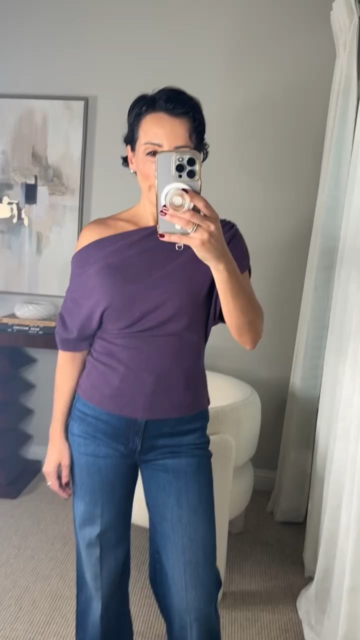 This plum off-the-shoulder top is such a beautiful way to dress up denim. I love the asymmetrical neckline and soft draping because they add interest while the fitted waist balances the volume of the wide leg jeans. The rich purple shade is perfect for fall, and this look could easily go from lunch to dinner with a change of accessories.

plum top, off the shoulder top, asymmetrical neckline, purple blouse, wide leg jeans, fall outfit ideas, date night outfit, women over 50 style, elevated casual style, fall fashion, feminine style, stylewitheugenia