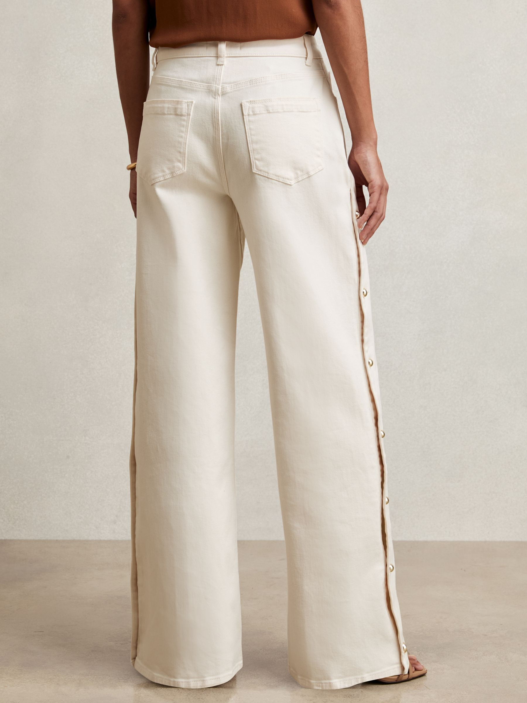 Side Button Wide Leg Jeans in Cream | Reiss US