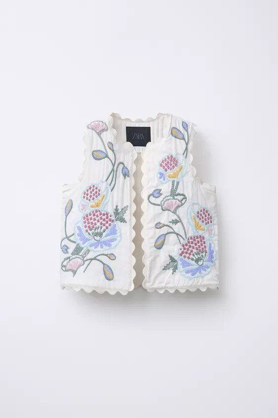 Vest with round neck and armholes. Embroidered flower detail. Scalloped trim. | Zara US