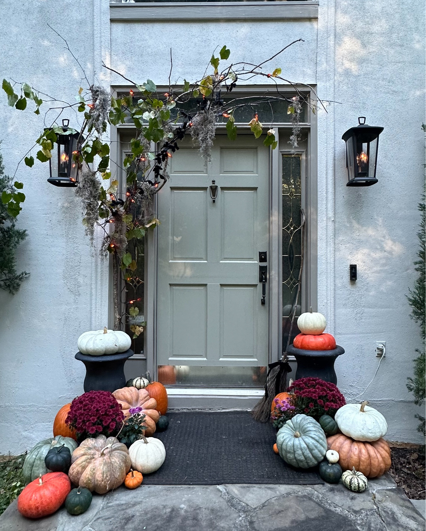 Southern Gothic Halloween porch reveal 🕯️🍂🐈‍⬛🥀 I built this moody setup starting with a foraged branch and muscadine vine from our woods, then layered in Spanish Moss, flicker flame string lights, and black butterflies for that haunted garden vibe.

Shop the look — heirloom pumpkins, string lights, and porch decor — all linked on my LTK ✨

#LTKhome #LTKseasonal #SouthernGothic #HalloweenDecor #PorchDecor

#LTKHalloween #LTKHome #LTKSeasonal