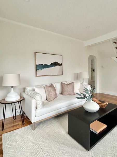 White sofa with black coffee table.

#livingroom

#LTKHome