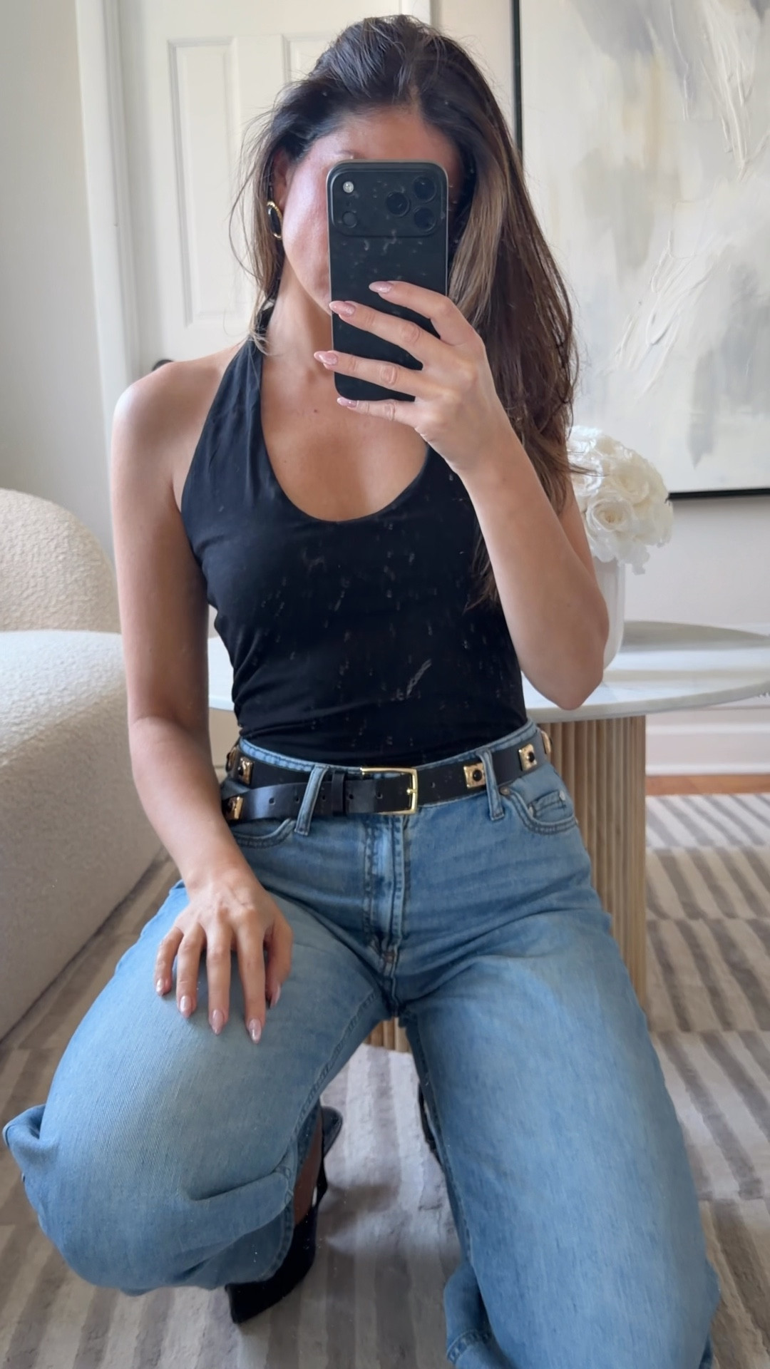 I love the look of a statement belts with a black halter and jeans. Summer outfit, date night, studded belt, outfit idea.

#LTKootd