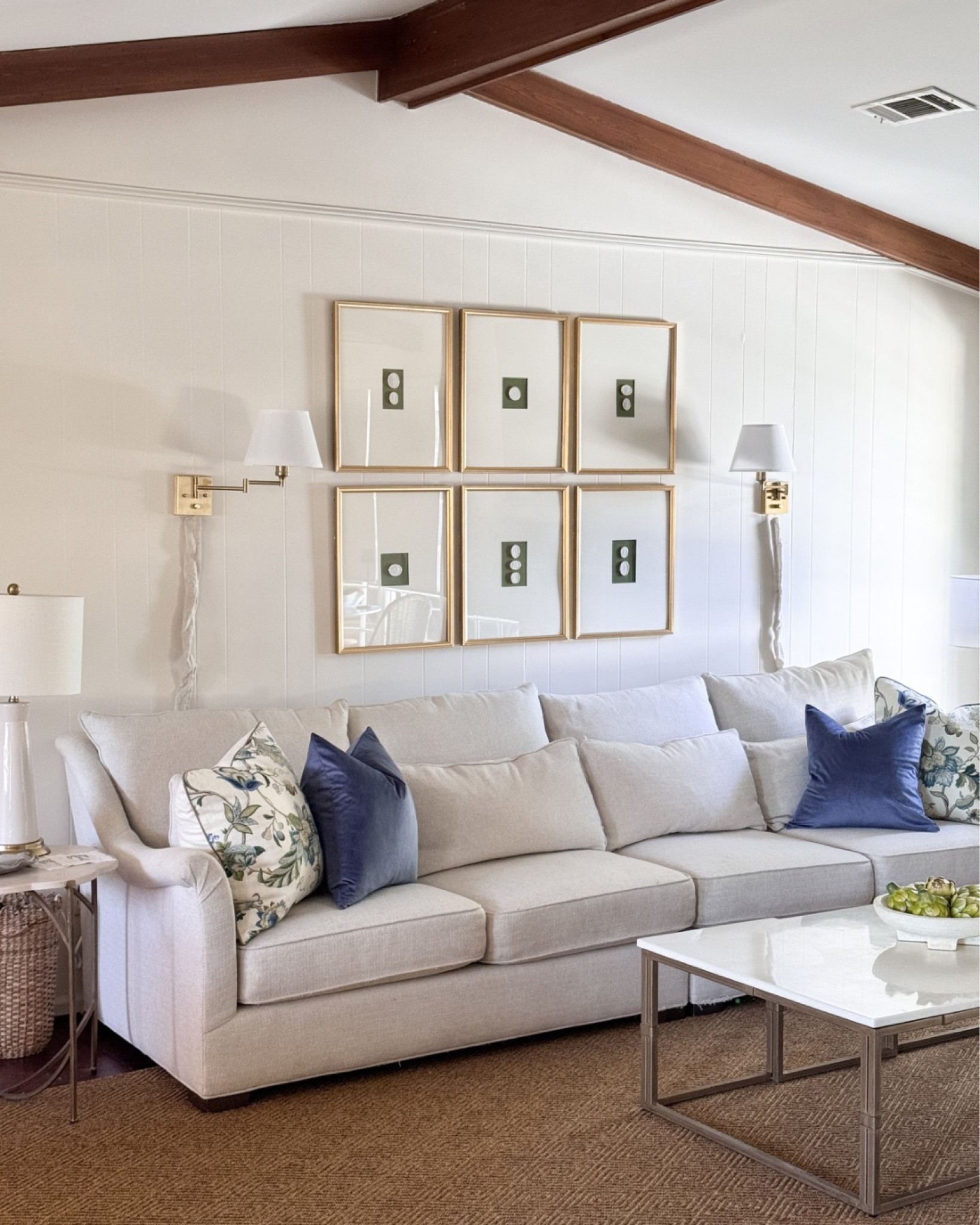 Intaglio Gallery Wall in southern traditional living room design. Amazon Gold antique frames, floral pillows, diamond pattern sisal rug (similar linked) exact is Stanton carpet in Burnt Umbra colorway. Swing arm sconces from Amazon 

#LTKFindsUnder100 #LTKHome #LTKStyleTip