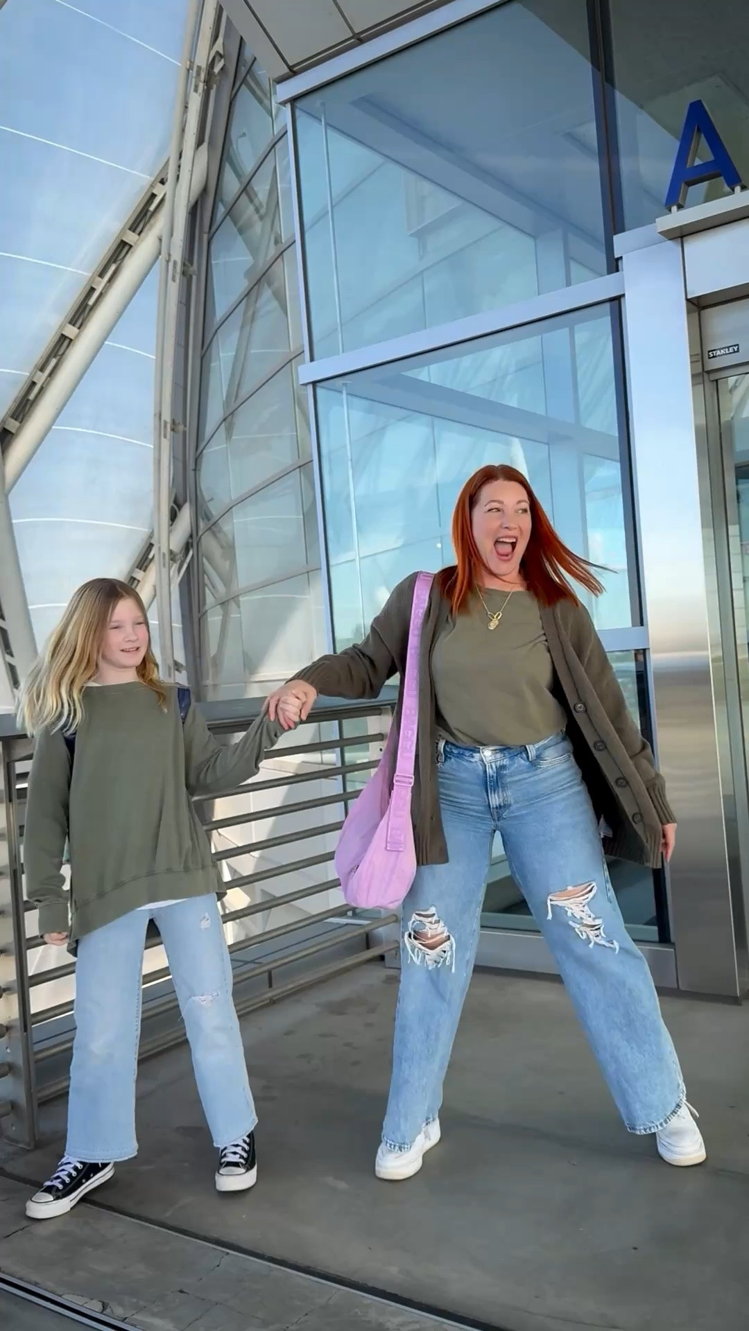 Gen alpha vs millennial styling: wide leg jeans and olive green tees // casual winter outfits // heading to Disneyland? These are perfect theme park vacation outfits 

#LTKOver40 #LTKFamily #LTKStyleTip