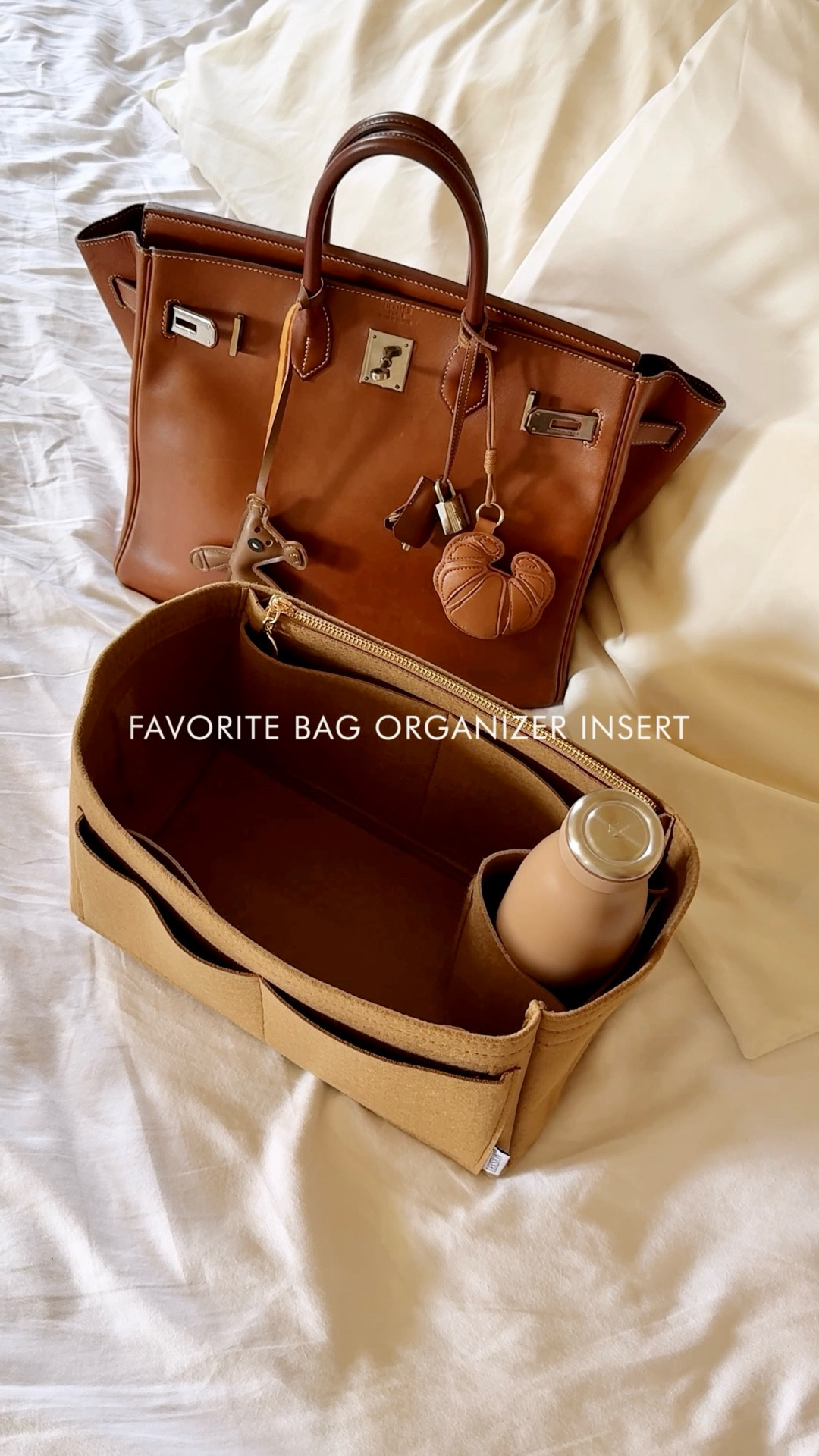 My favorite bag organizer insert. It’s affordable, softly structured, keeps items organized, and best of all, it has a dedicated water bottle holder! Great to maintain everyday sanity 😂

This particular brand is affordable and has lots of different sizes, colors and options!

If you’re looking for a thicker insert with custom measurements, I highly recommend the Etsy one.

#LTKItBag #LTKSaleAlert #LTKStyleTip