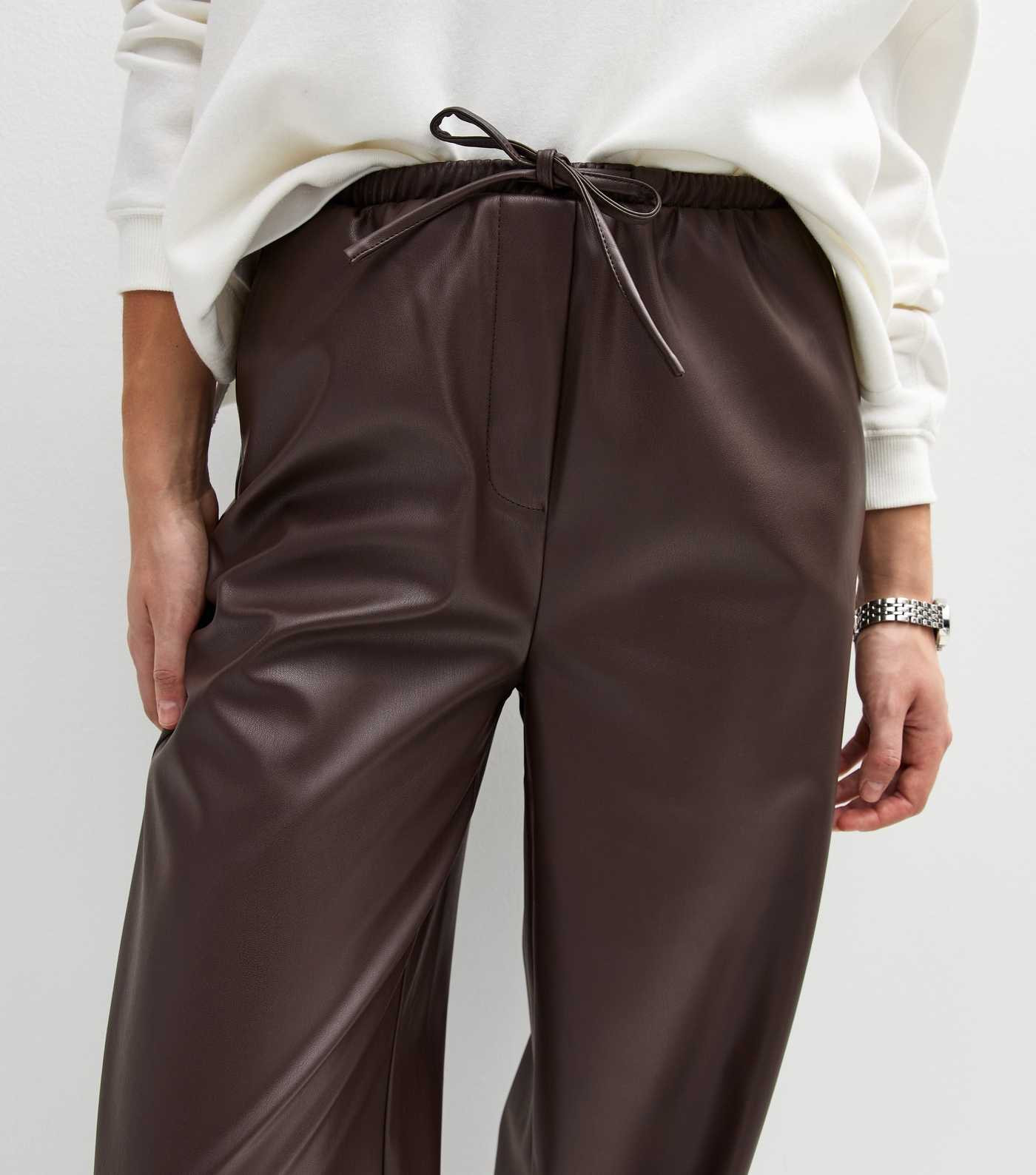 Dark Brown Faux Leather Wide Leg Trousers
						
						Add to Saved Items
						Remove from Saved... | New Look (UK)
