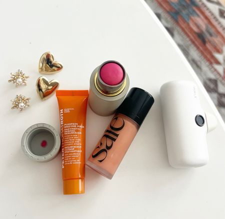 Trip MVPs - faves from my Montana trip:
* fave blushes: the Westman is shade Poppet and currently on sale at link, Saie is shade Peachy (and they recently just dropped a new trio of blushes that includes a NEW pink, linking too!)
* perfect travel mask in seasonally-appropriate pumpkin (linking mini from set I have perfect for travel and also the regular size)
* the best phone charger, hands down
* the earrings I’ve been wearing to keep things sparkly 

not shown: one of my fave lip balms that really shows it’s strength in dry / cold weather and my fave travel fave wipes

#LTKSeasonal #LTKtravel #LTKbeauty