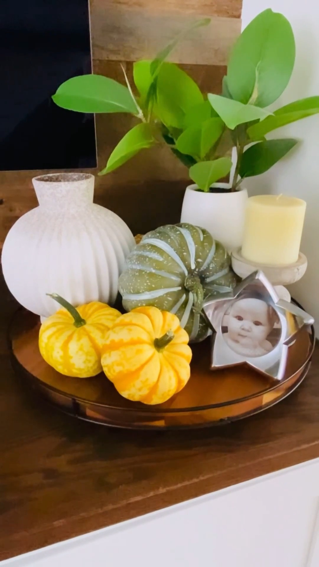 Adding a hint of autumn into my decor now that August has slipped away. I started with a Lazy Susan by Hearth and Hand from Target. Larger pieces, like this vase from Joann (sadly, the store is closed) are easiest to work in first, followed by some greenery, which I propped up with a decorative box. A distressed candlestick holder, a faux green pumpkin, a small photo frame, and some pumpkins I grew in my garden finish it off.

Many of these pieces (faux plants and pumpkins, candle holders, decorative boxes, and ceramic vases) can be found at craft stores like Michael’s or Hobby Lobby. Suggested options are linked to this post.

What do you think? Do you have a lonely corner that could use some sprucing up?

#falldecor #autumn

#LTKSeasonal #LTKStyleTip #LTKHome