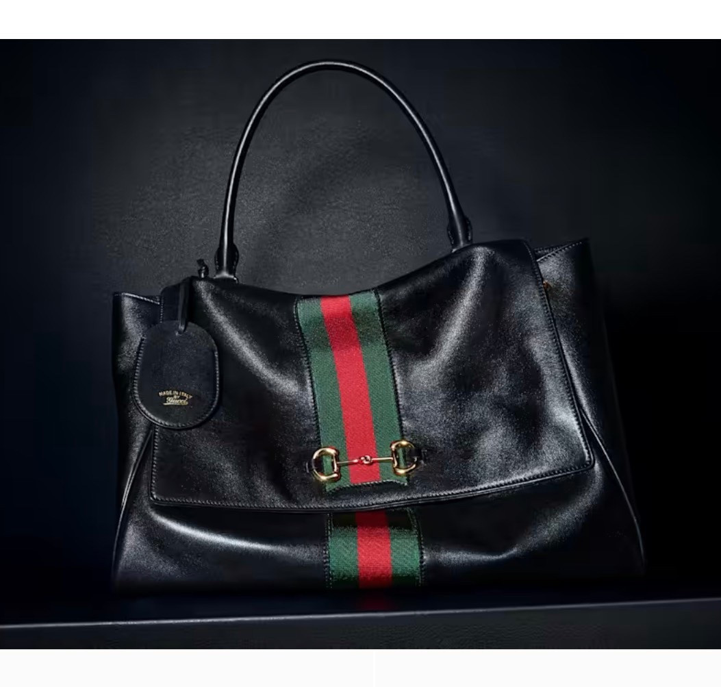 Gucci

Paparazzo large top handle bag

This style pays tribute to the House's emblematic Horsebit and Web with a top handle design, and is crafted from soft leather.

#LTKTravel #LTKWorkwear #LTKootd