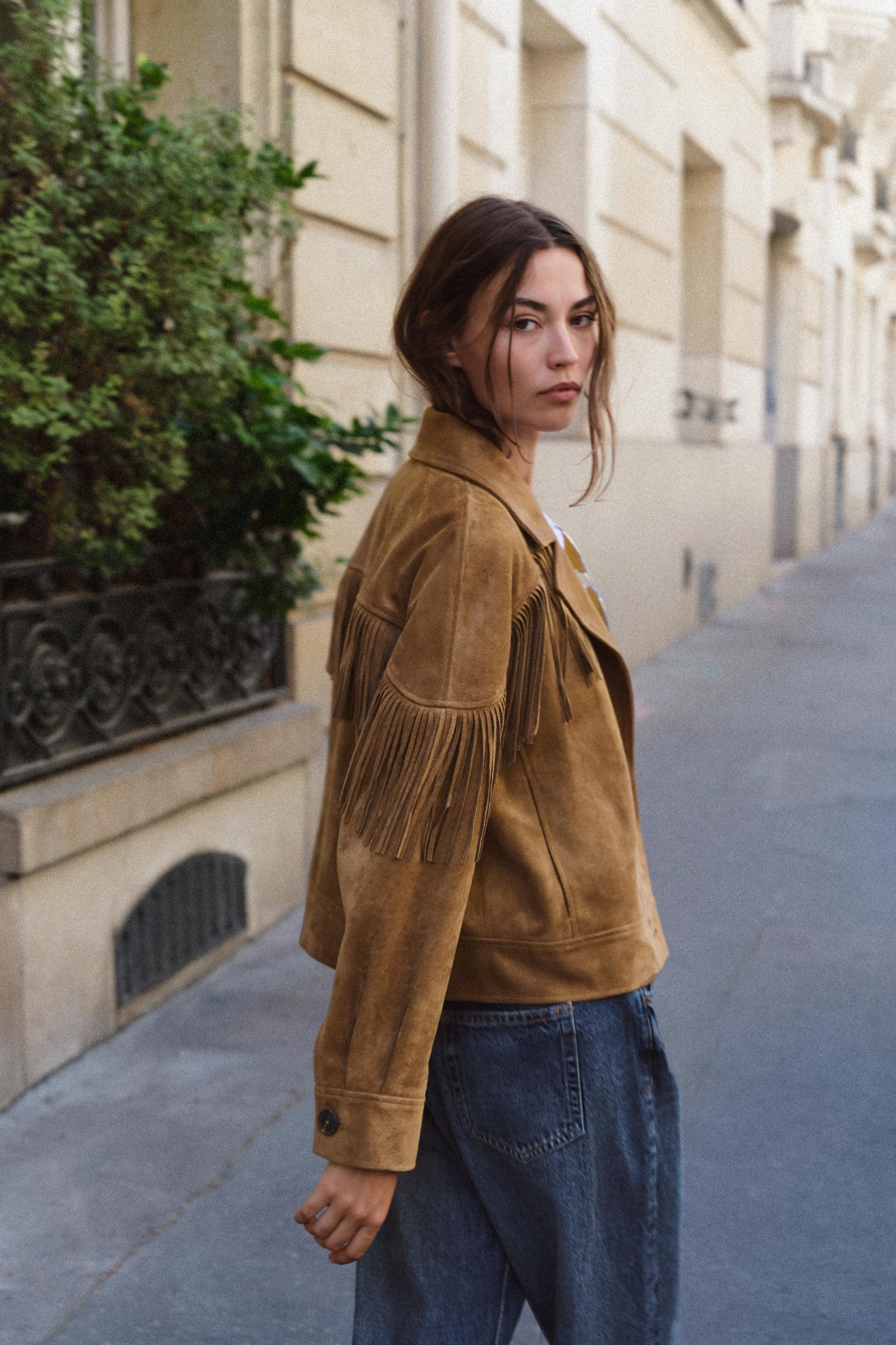 Faux suede jacket with a lapel collar and long sleeves featuring fringe details. Front pockets. F... | Zara US