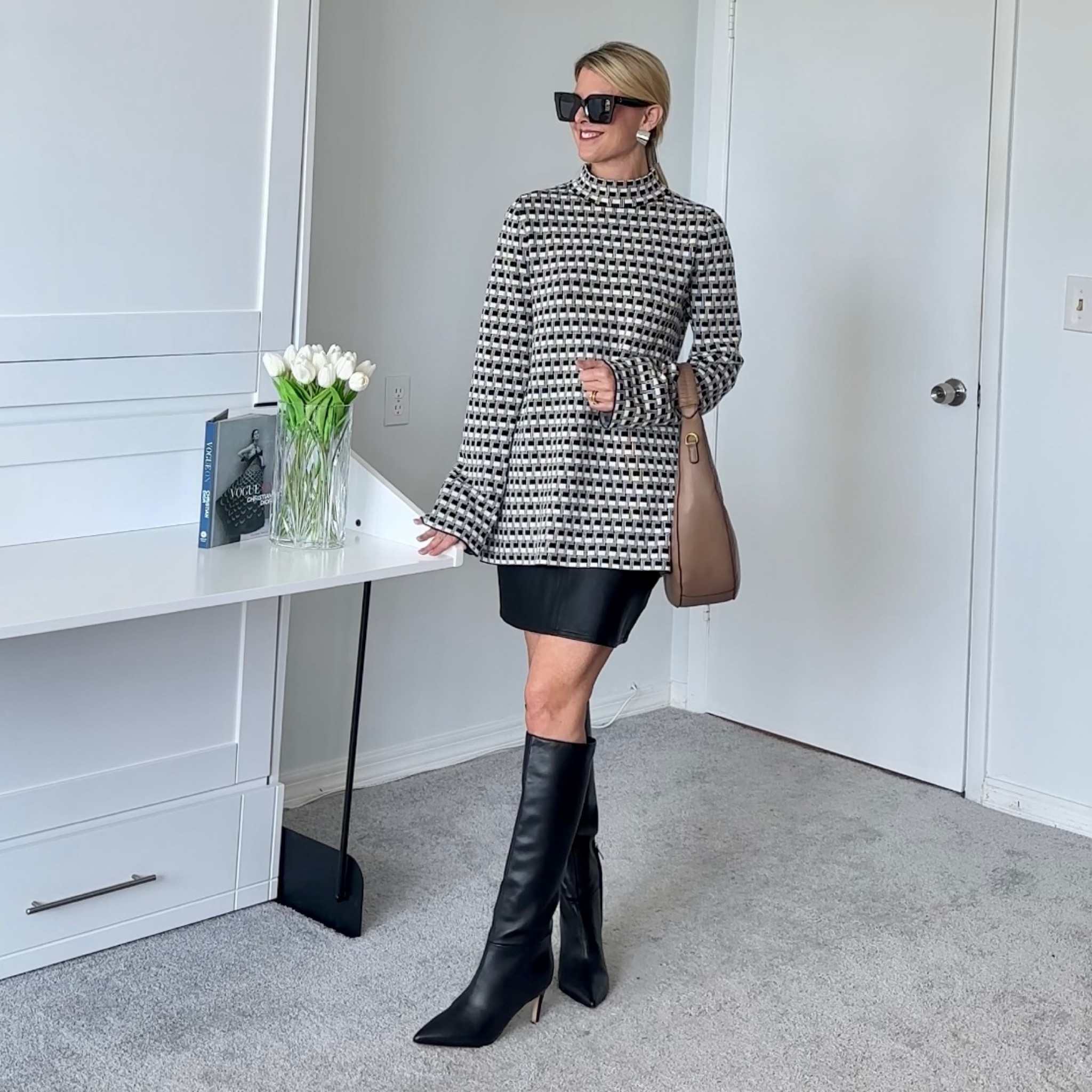 The boots I needed to size down to a 7 instead of the 7.5 I usually wear in a boot.  These come in two calf sizes.   I’m wearing the narrow calf size.

The top is true to size

My skirt is older.    It’s also a size or two too big which I prefer for a slightly looser/longer fit.    

#LTKSeasonal #LTKshoecrush