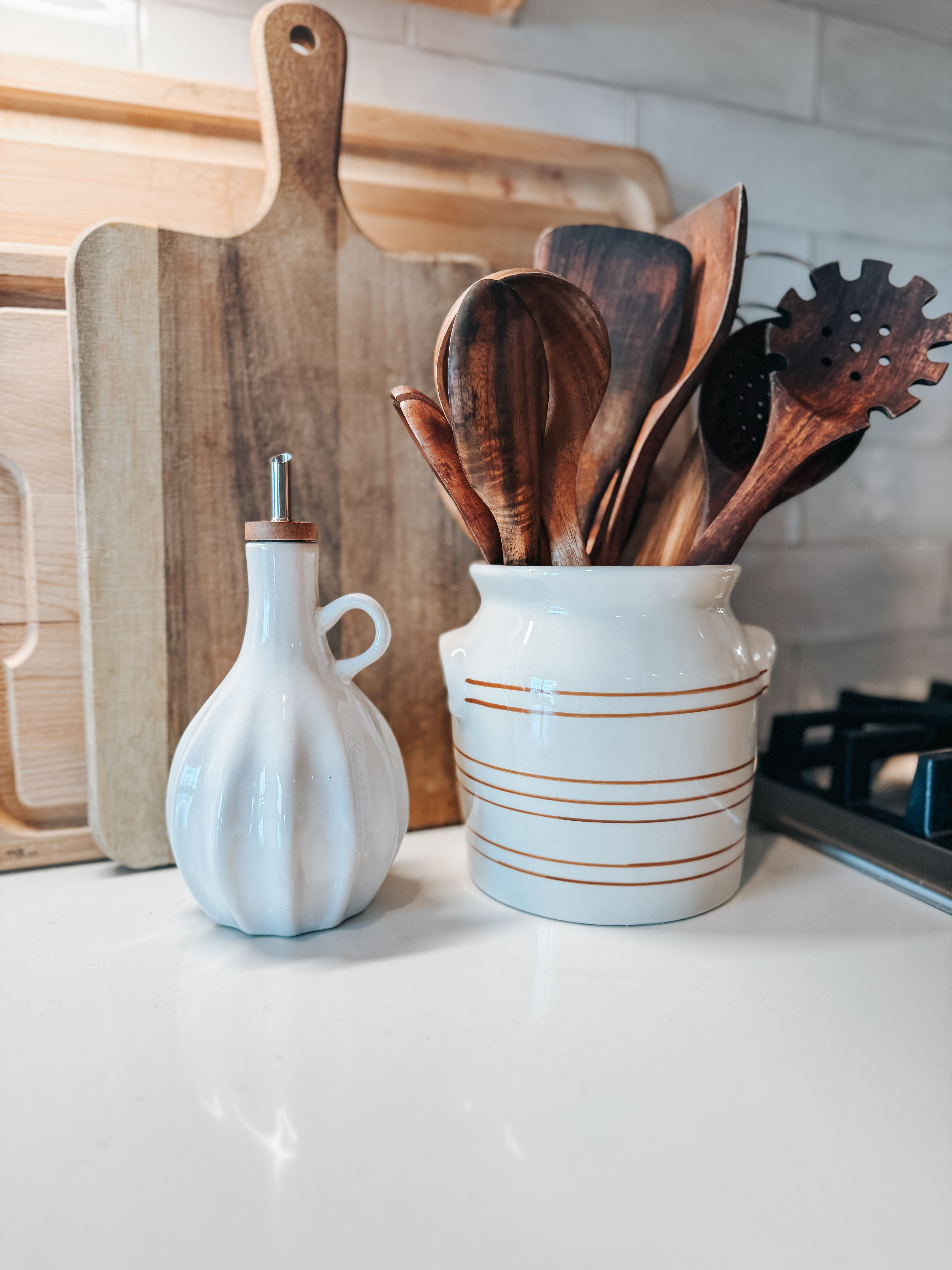 A little kitchen counter moment 🤍
The striped crock is from McGee & Co. and the oil + vinegar set is from Hearth & Hand at Target. Simple, neutral pieces that make everyday styling feel elevated.  

 #LTKHome