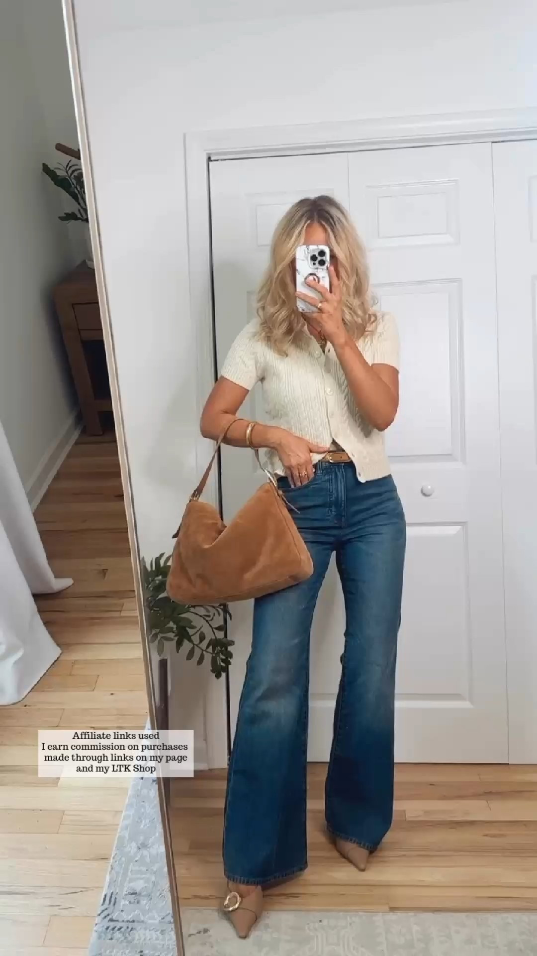 Fall outfit with jeans

Cable knit cardigan, flare leg jeans, tan suede bag, suede belt