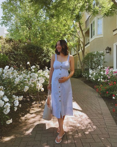 Spring summer maternity linen cotton dress 

Seraphine dress - recommend sizing up from your regular pre-maternity size if you are bigger busted (size 4 would be a better fit, 32DD), a few left at Nordstrom, linked to other similar baby blue style dress 
Madewell tote 
Tory Burch sandals tts

#LTKBump #LTKStyleTip
