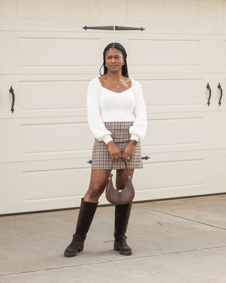 First outfit inspiration post of the year! I love a good mini skirt and knee-high boots look. This combo always reminds me of Cher and Dionne’s looks in Clueless. I paired this cute plaid mini skirt with my Adrija Boot from @justfabonline. These dark brown suede boots definitely give off a 90s vibe with the lug sole heels, making this look 2 parts preppy with a dash of edge. 😎😍

#LTKshoecrush #LTKstyletip #LTKmidsize
