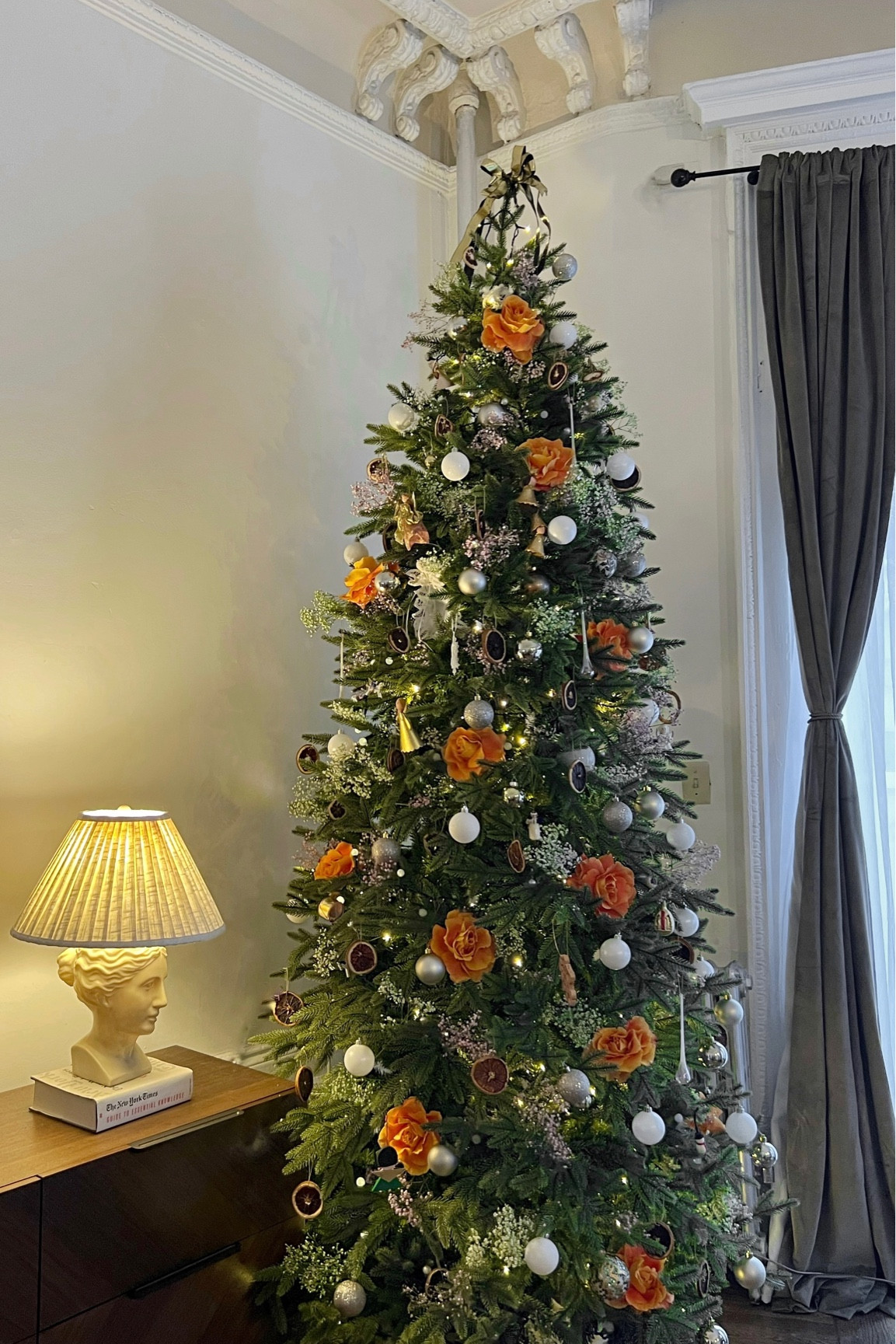 Slim faux Christmas tree, bust table lamp, taupe velvet curtains 

#LTKhome #LTKHoliday #LTKstyletip