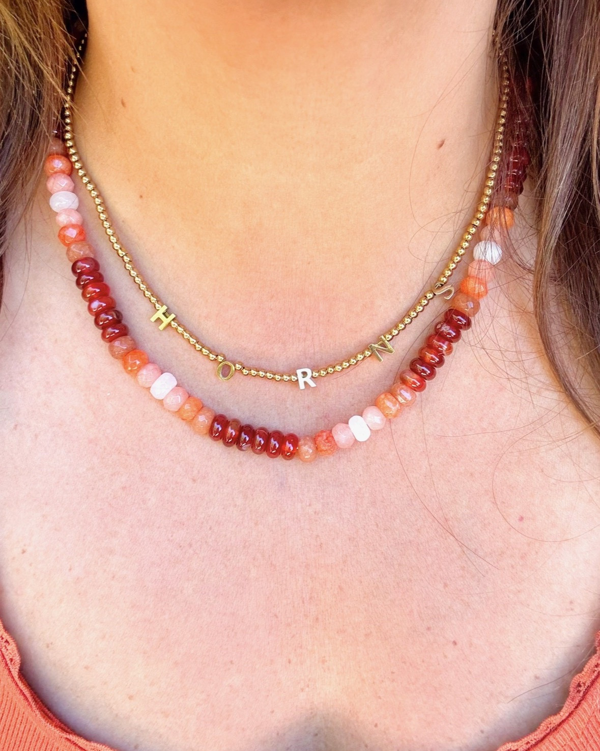 All of @goldenthreadinc is ⁠30% off for Christmas in JULY including my favorite combo of the burnt orange gemstone necklace ($78-> $54) and Horns beaded necklace ($38 -> $26)