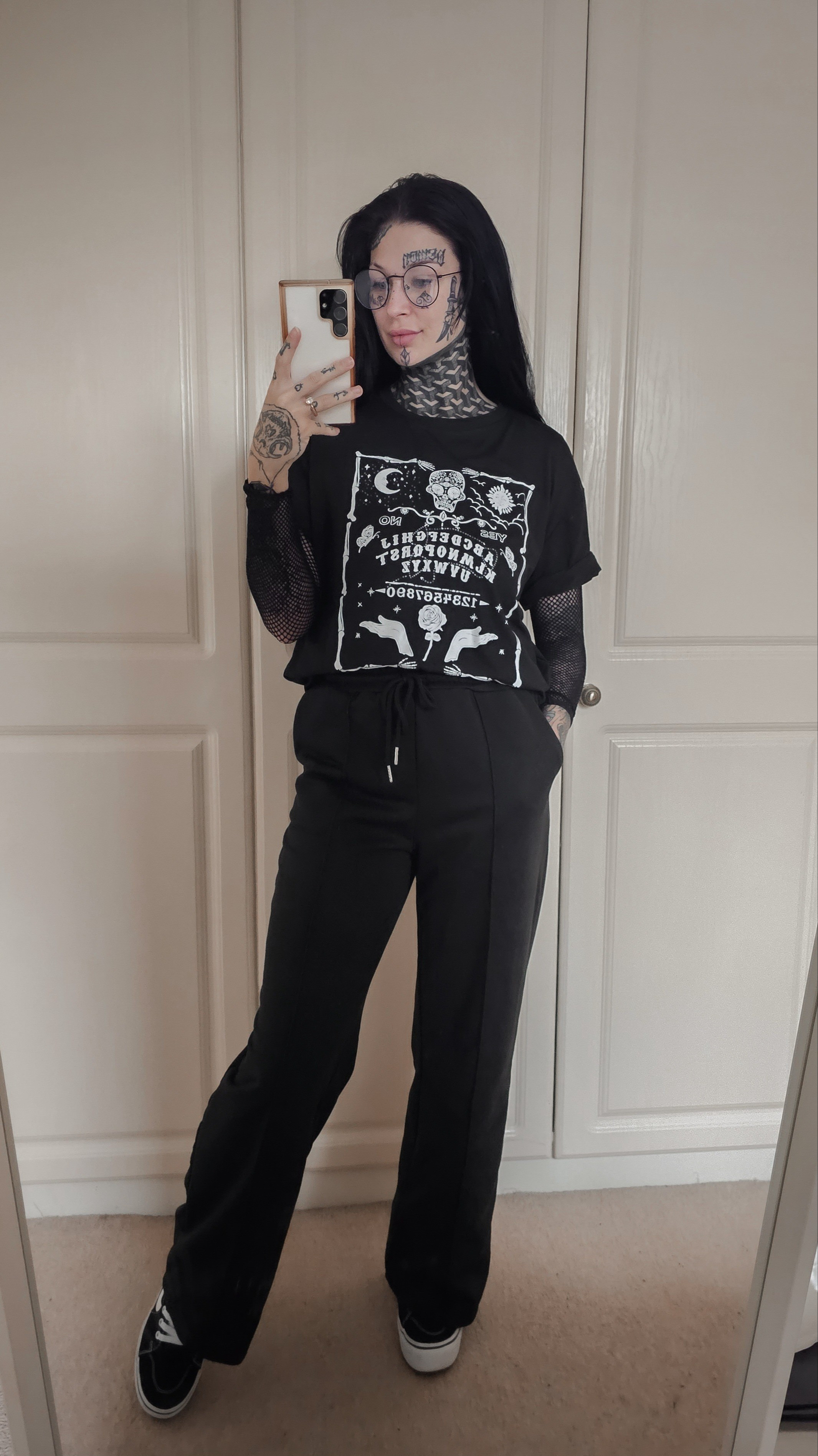 Casual alternative / academia outfit inspo Ouija tshirt Fishnet topWide leg joggersPlatform vans

#LTKfindsunder50 #LTKstyletip #LTKworkwear