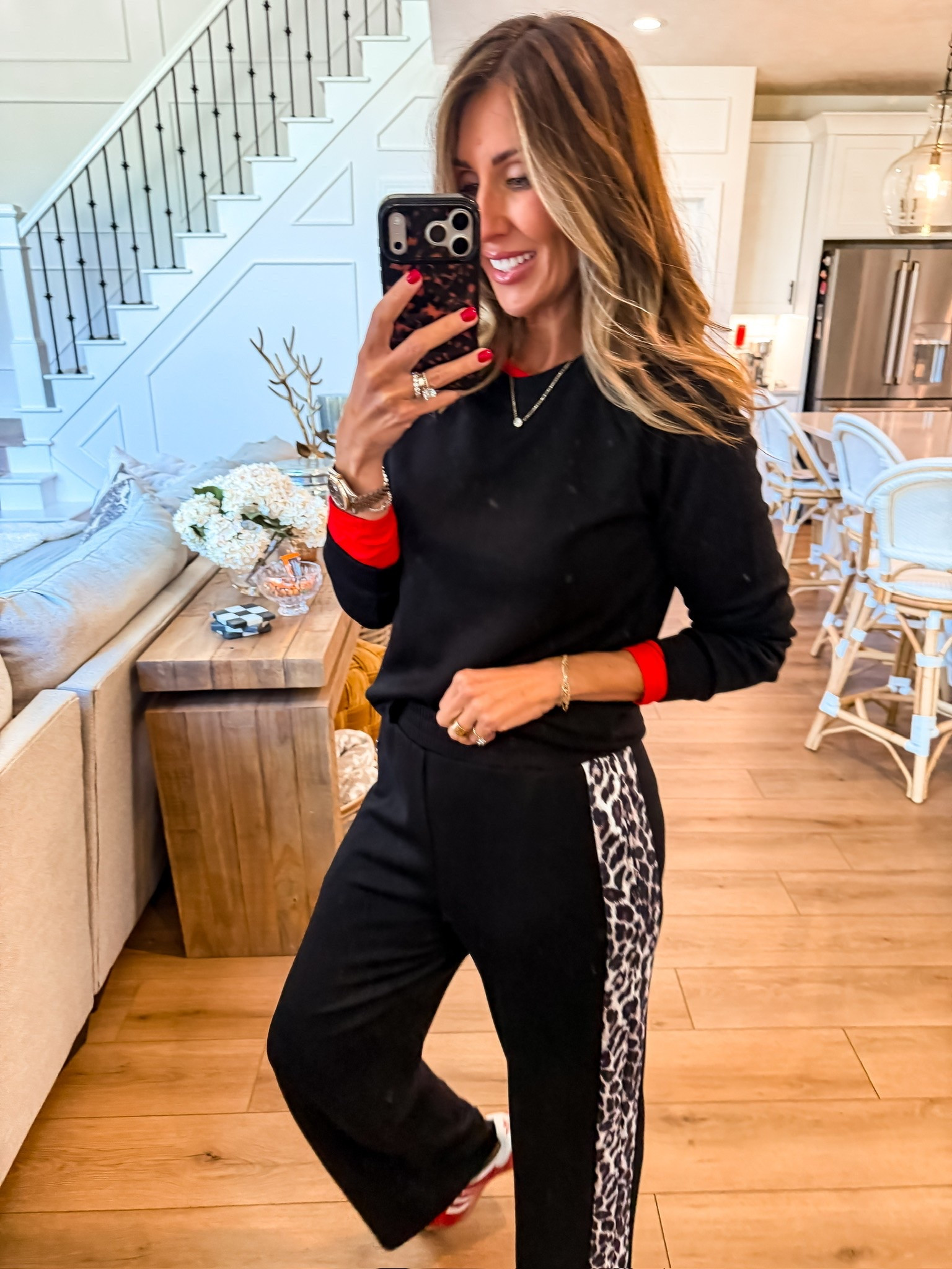 A matching set, but way more fun. The leopard stripe and pop of red give this black athleisure look just enough personality for errands, school pickup, or a casual weekend.

leopard joggers, matching set, athleisure outfit, sports mom style, casual fall outfit, black lounge set, leopard print, fall casual style, everyday outfit, women over 40 fashion, fall athleisure, TheMomInStyle