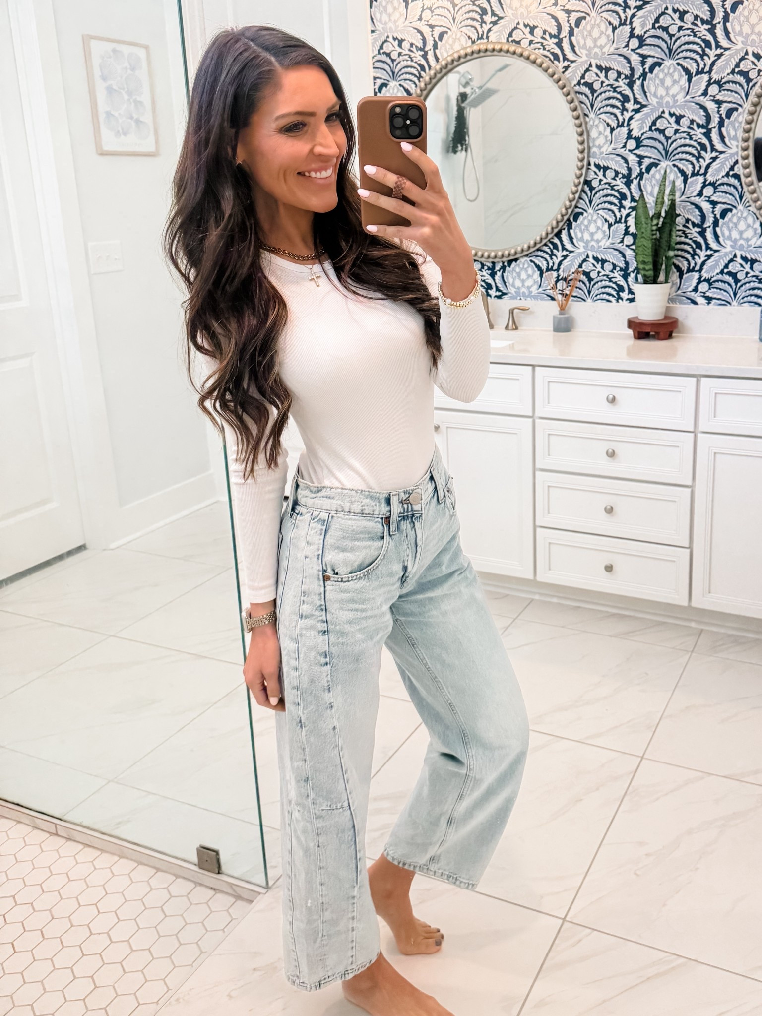 Wearing a 00 in color Light Wash in the barrel jeans. Recommend sizing down one. No stretch & naturally has a slouchy fit. 
Top: XS

#LTKMidsize #LTKootd #LTKFindsUnder50