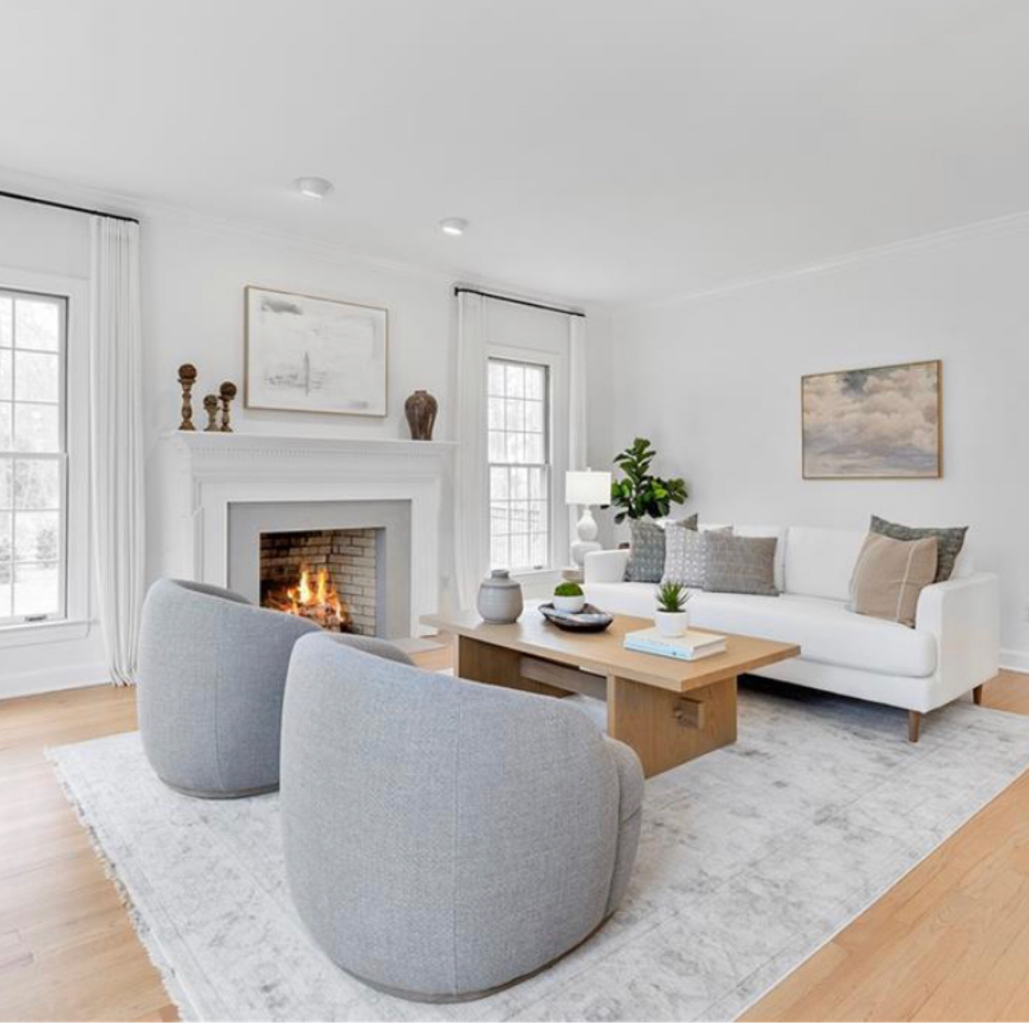 White sofa, Barrel chairs, neutral room, oak coffee table 

#LTKhome #LTKunder100 #LTKfamily