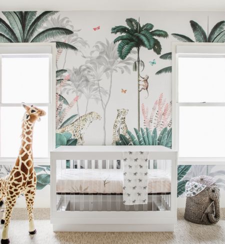 Wild for this nursery. 🦒🌴🐅

-My clients have a love for animals, nature & travel and wanted a safari theme that would be gender neutral. A safari themed mural was at the top of the top of the list and we found the perfect one that set the tone for the design. 
The Color Scheme is a  mix of greens, white lacquerd furniture, acrylic accents and brass details 
-The Design: The mural was the jumping off point and we loved how it didn't feel too childish or too adult for the space. We kept the furniture neutral to allow the mural to make the statement while also adding a few fun safari themed items. The modern details like the lion head pulls on the cabinet, giraffe lamp on the dresser and elephant linen basket pulled the theme together. 


#LTKhome #LTKbaby #LTKbump